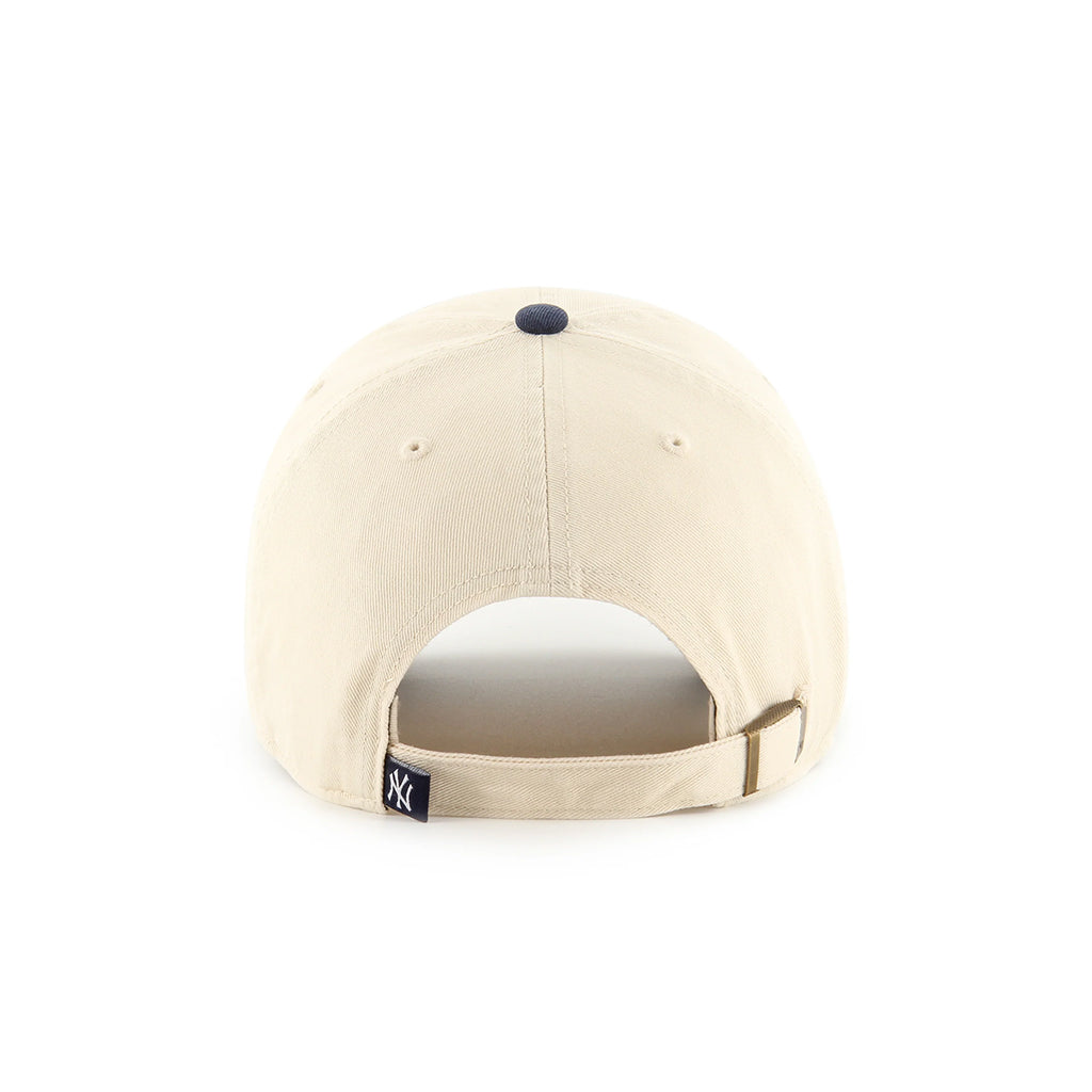Beige baseball cap with a small logo on the back against a white background