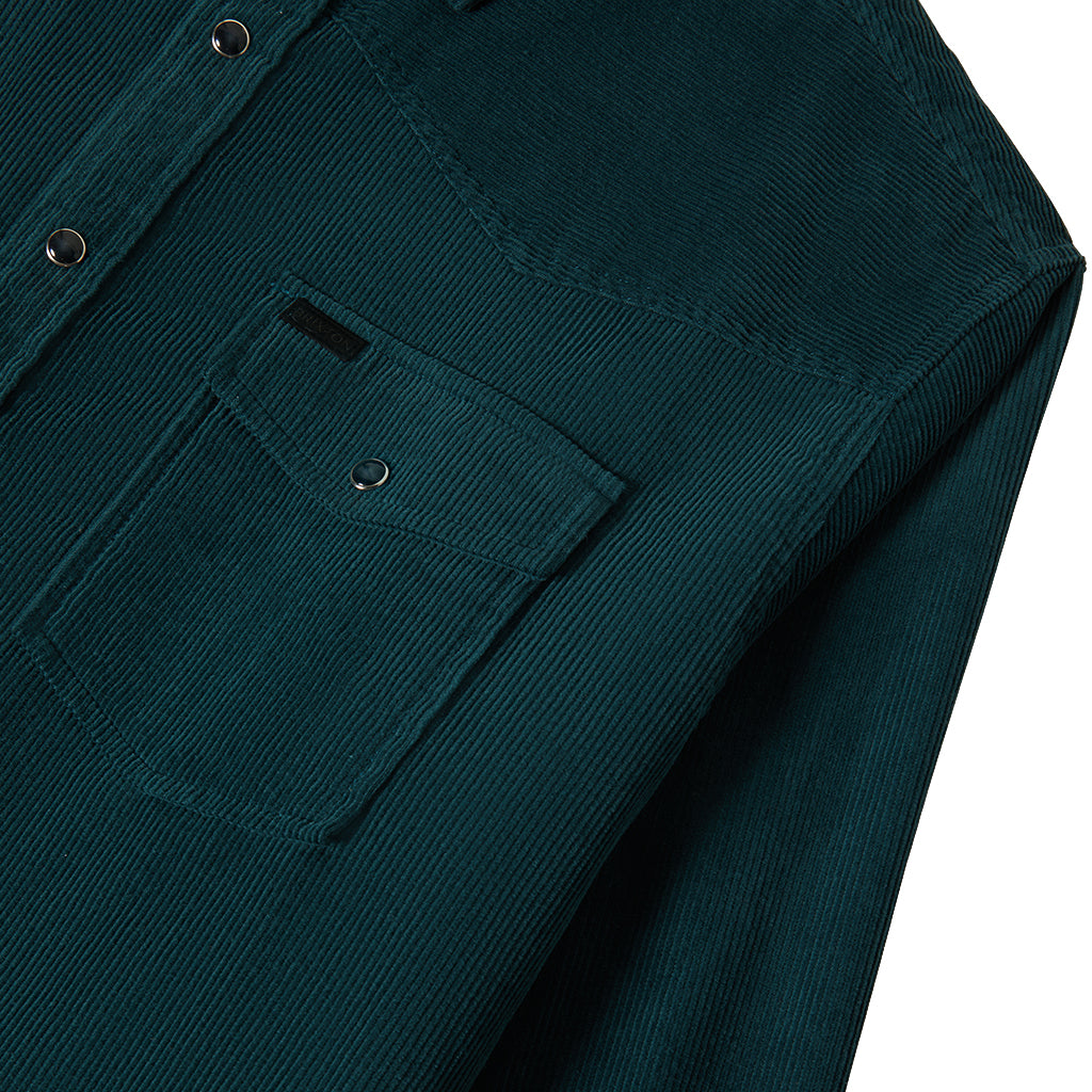 Pocket detail on a green corduroy overshirt