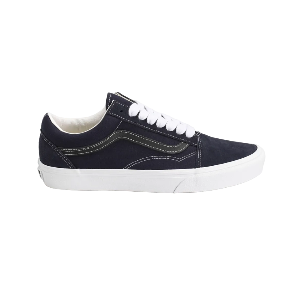 A classic low-top canvas sneaker in dark navy blue with white laces and a thick white rubber sole, shown from a side profile view against a plain white background.
