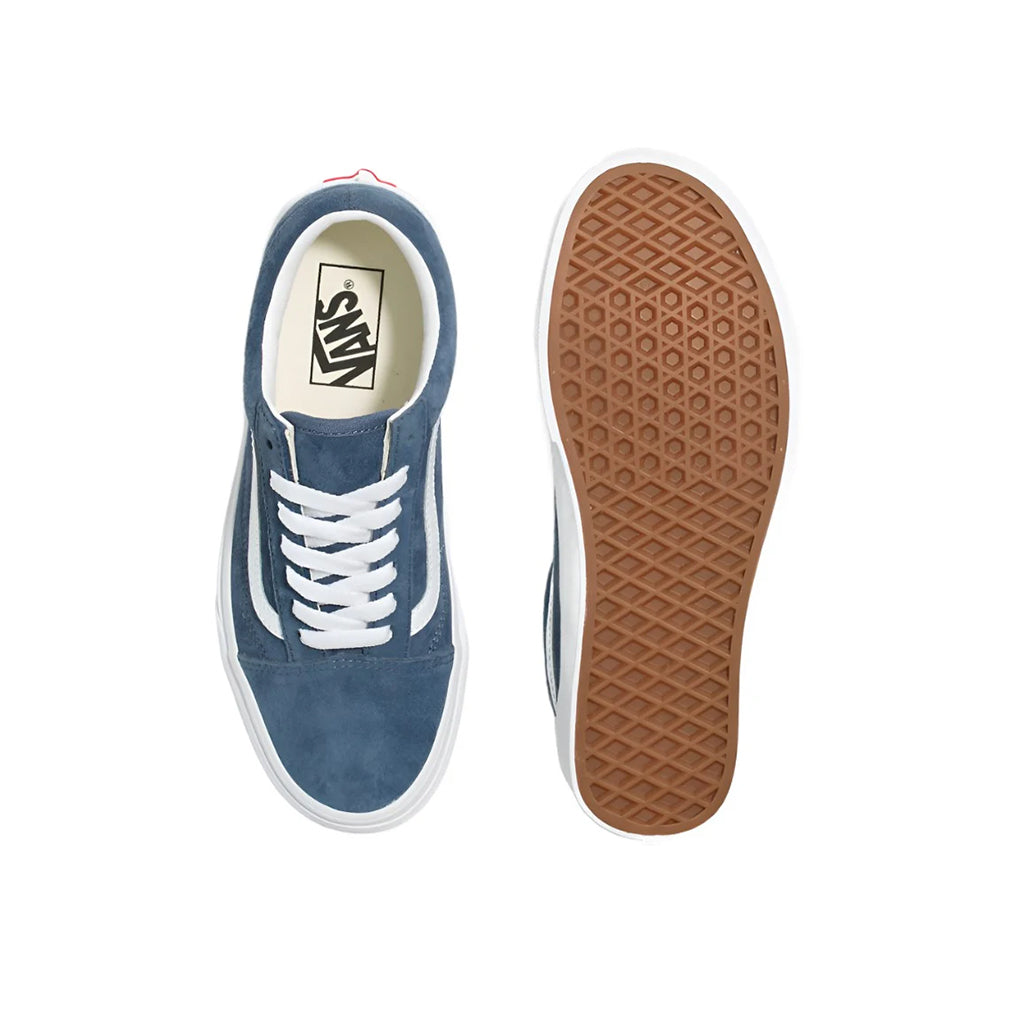 Blue sneaker with white laces and brown sole on a white background