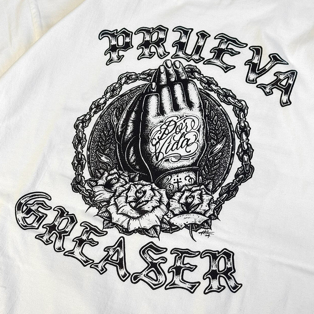 White t-shirt with black graphic design featuring a hand, chain, and roses on a white background