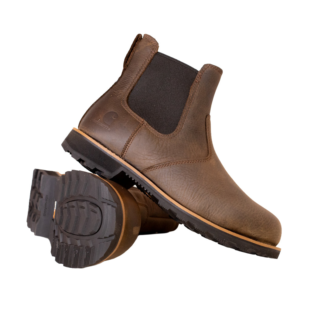 Brown leather boot with black sole on a white background