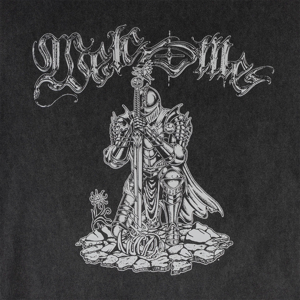 Black and white illustration of a warrior figure with ornate text on a black background