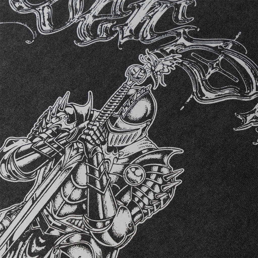 Black and white illustration of a warrior on a dragon with ornate details on a black background