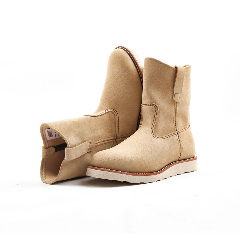 Pair of light brown Peco Red Wing Boots on a white background