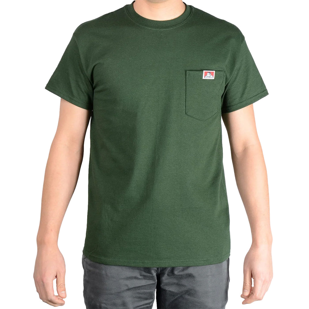 Green t-shirt with a small logo on a plain background