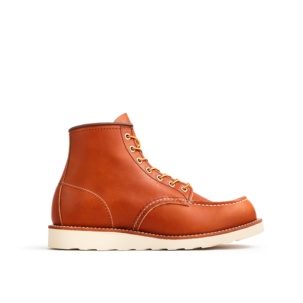 Brown leather boot with white sole on a white background