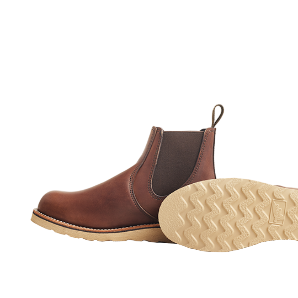 Brown leather Chelsea boot with beige sole on a white background