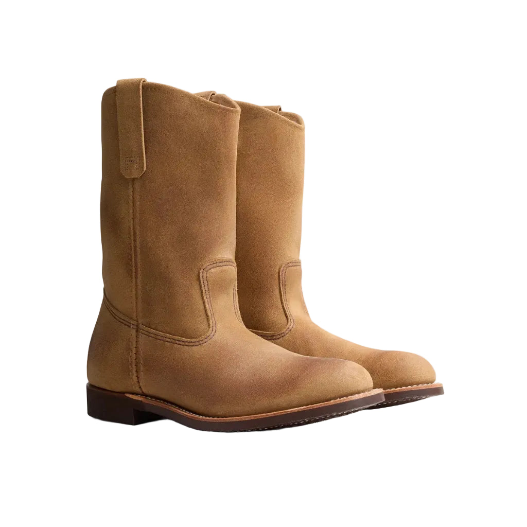 Pair of brown leather boots on a white background