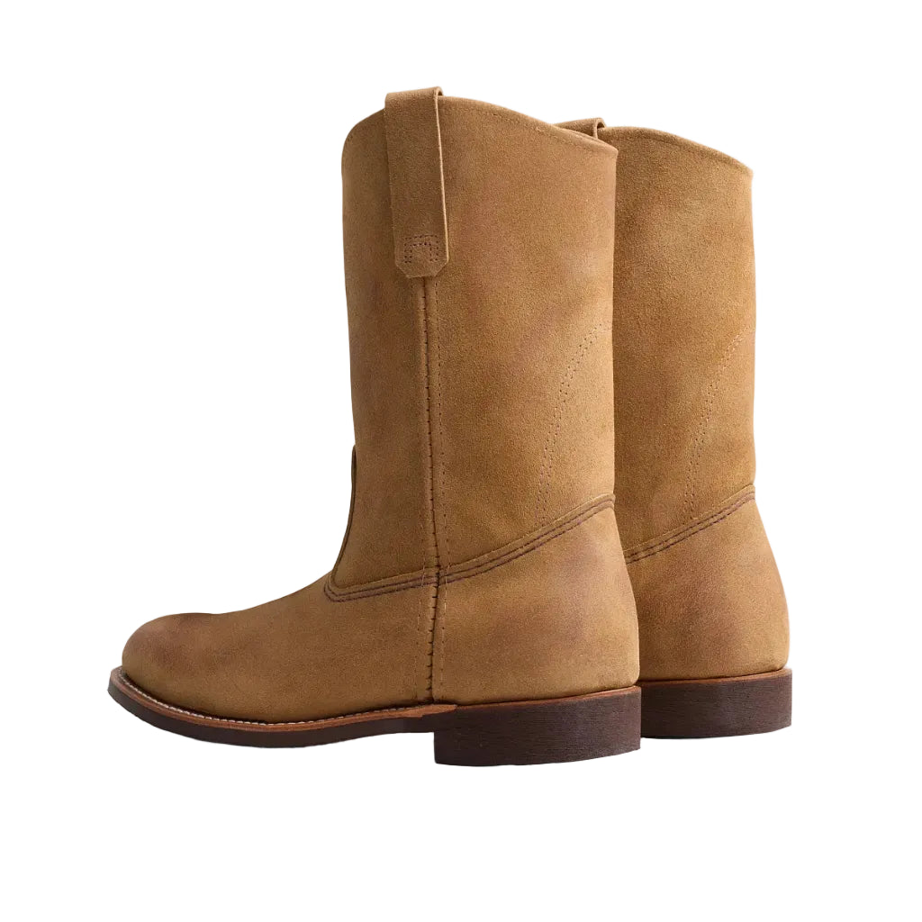 Pair of brown leather boots on a white background