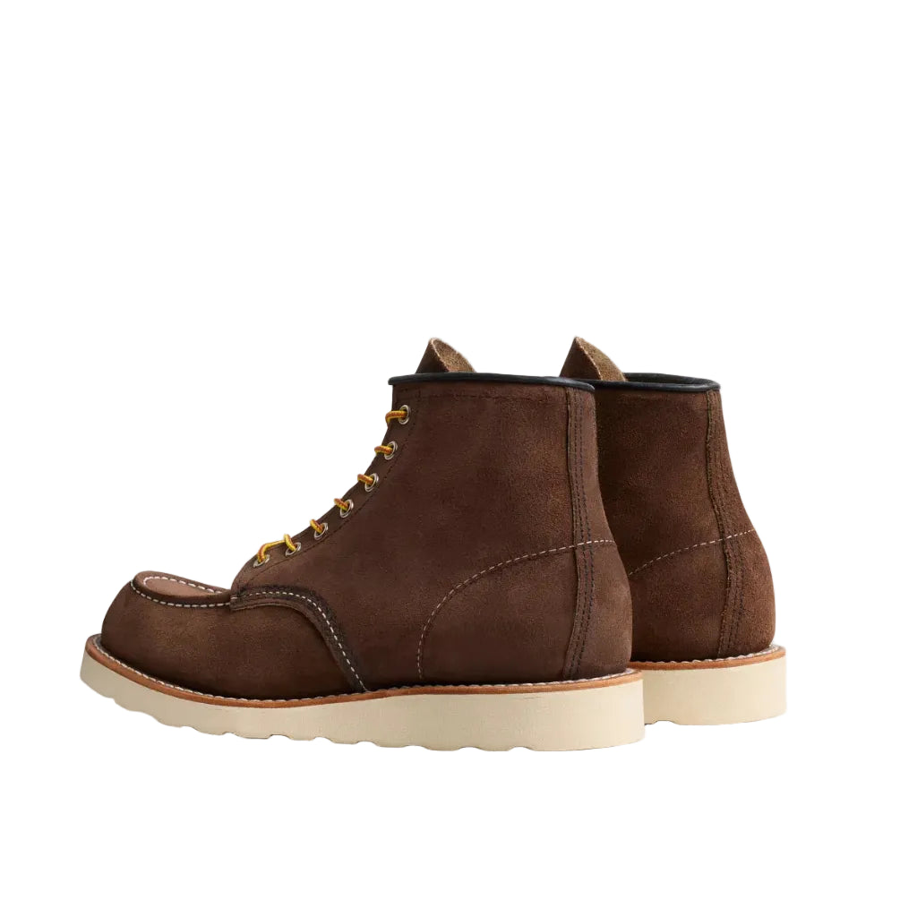 Pair of brown leather boots on a white background