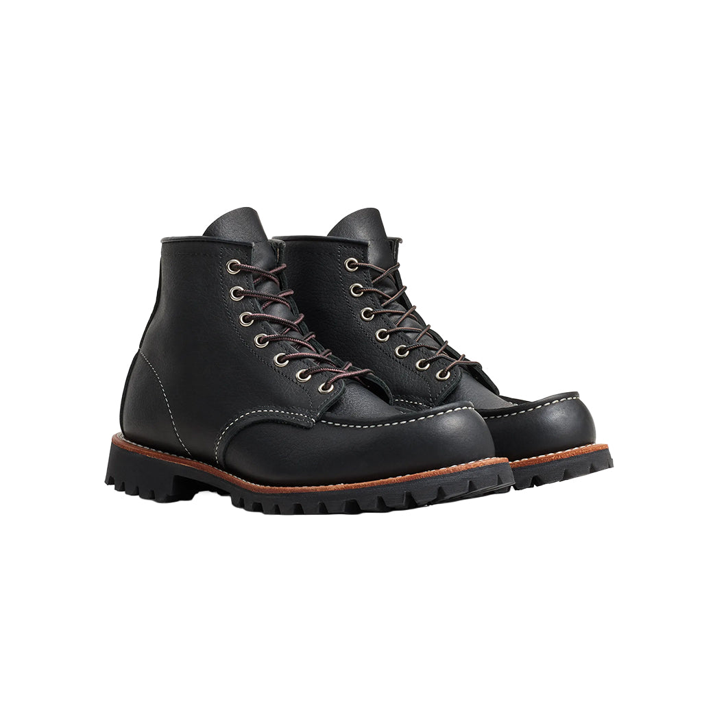 Pair of black leather boots on a white background