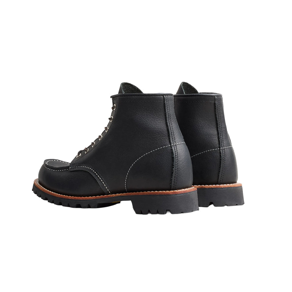 Black leather boots on a white background