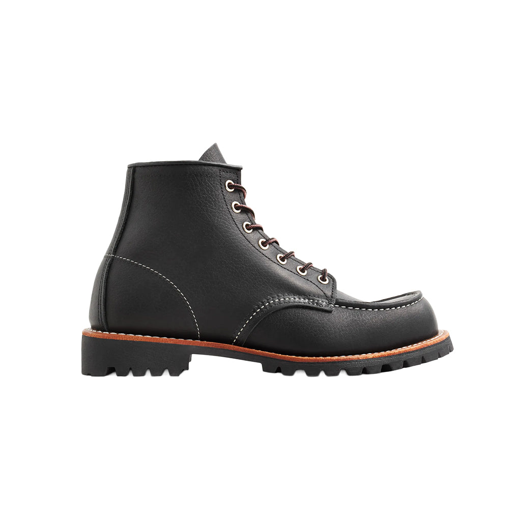 Black leather boot with a white background