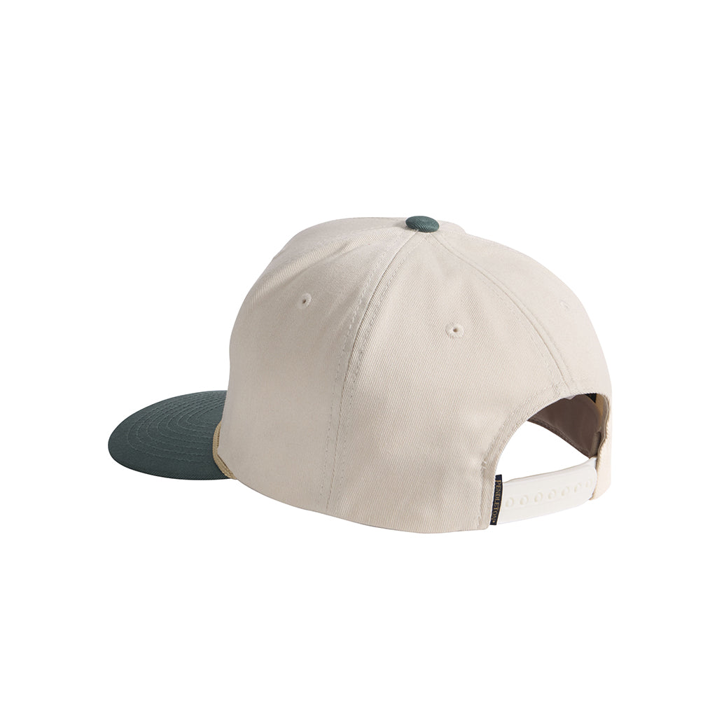 Beige cap with green brim on a white background