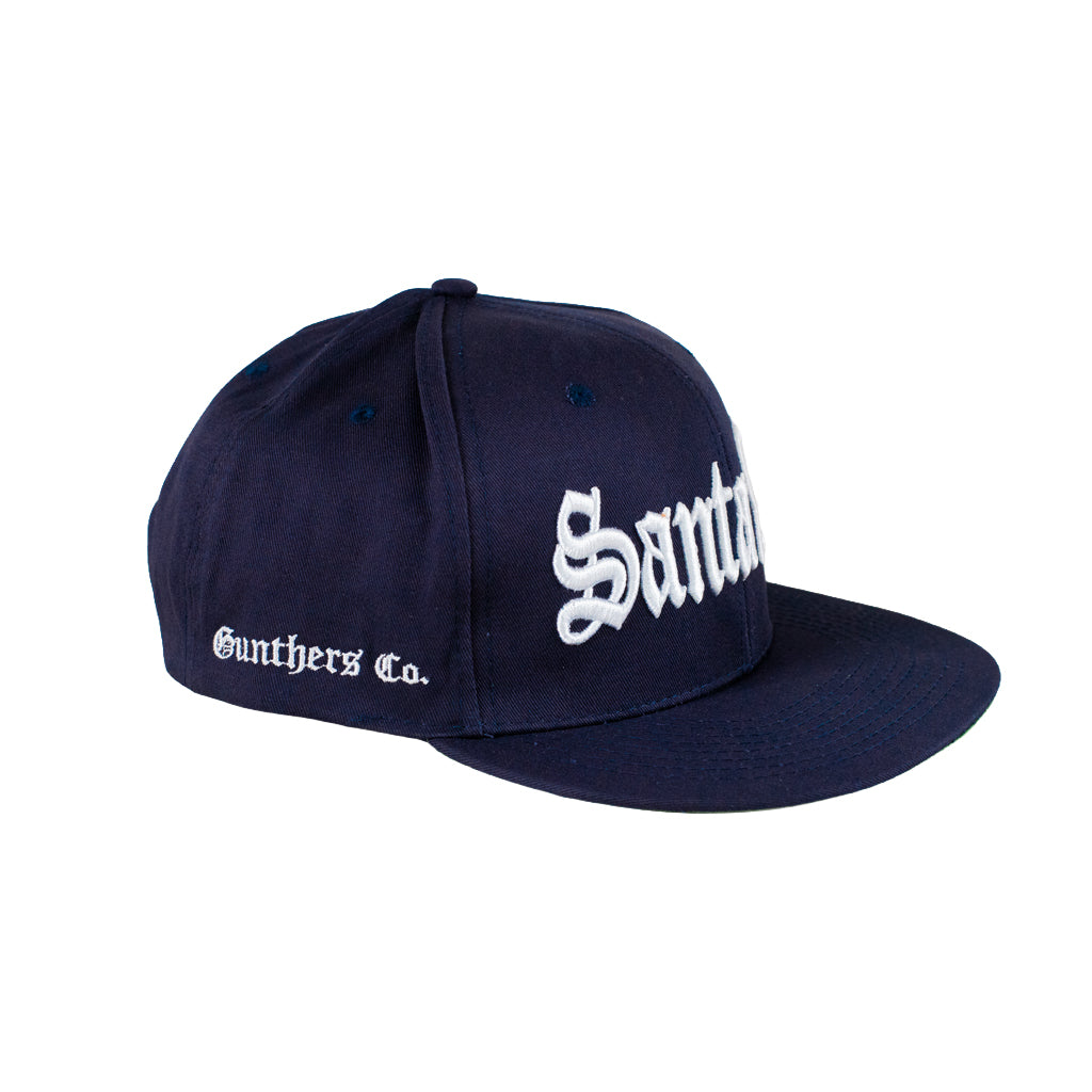 Navy blue cap with white text on a white background