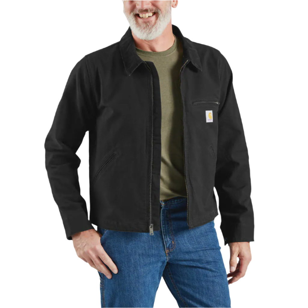 A male model wearing a black Carhartt Detroit jacket with a relaxed fit. The jacket features a corduroy-trimmed collar, snap-adjustable hem, and multiple pockets.