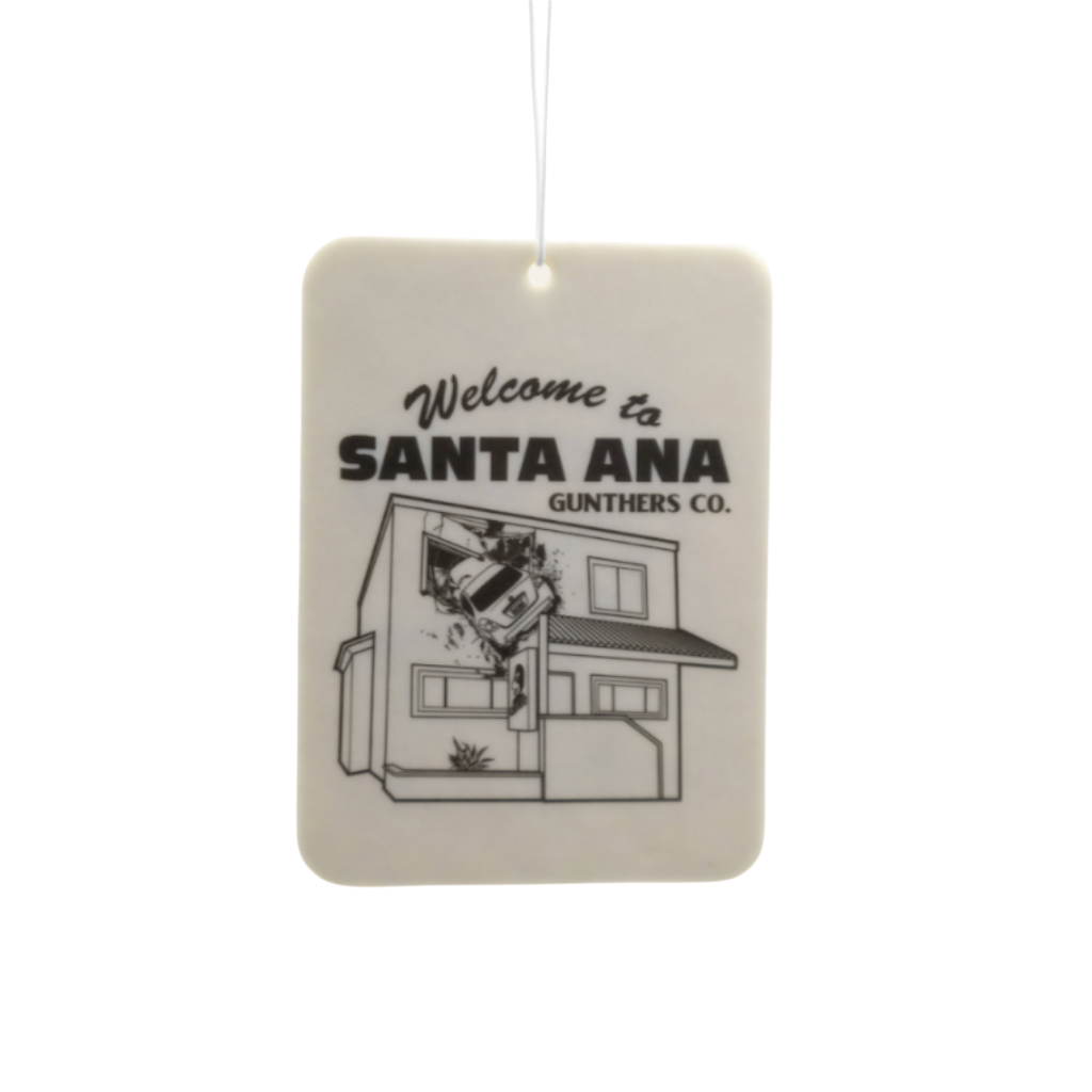 A hanging card air freshener with 'Welcome to SANTA ANA GUNTHERS CO.' printed on it.
