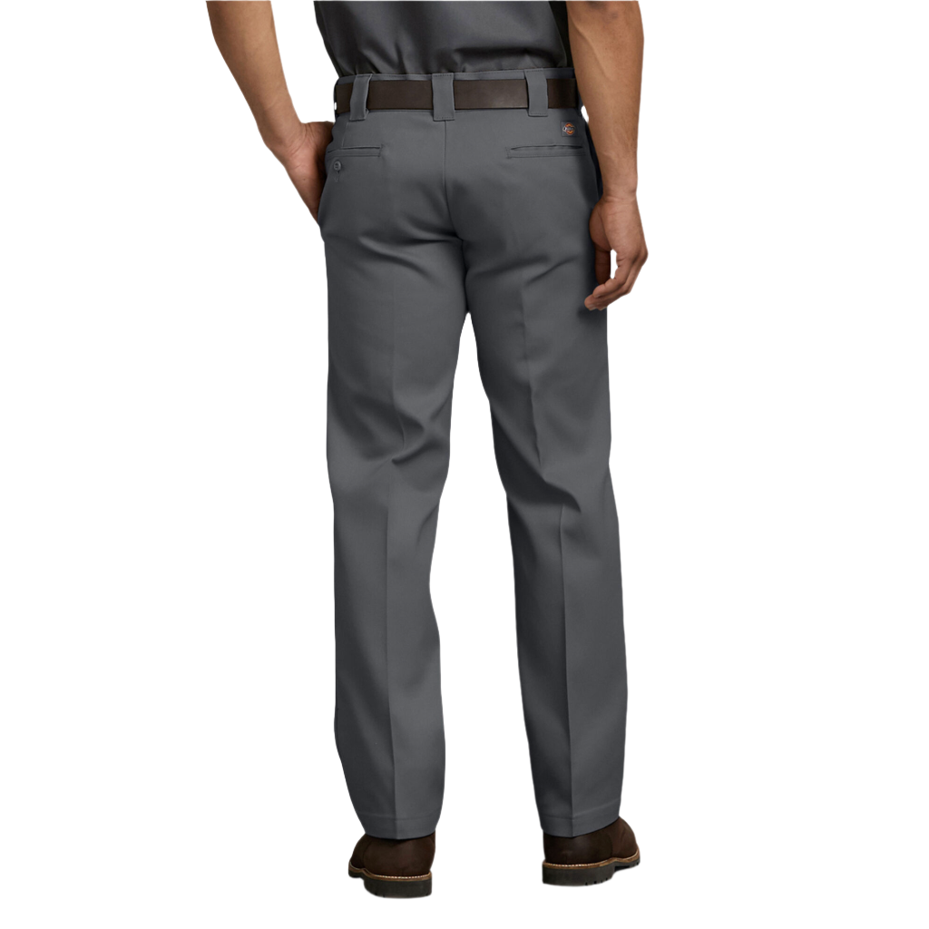 A person standing wearing charcoal grey Dickies men's 873 flex slim fit work pants, a belt, and shoes.