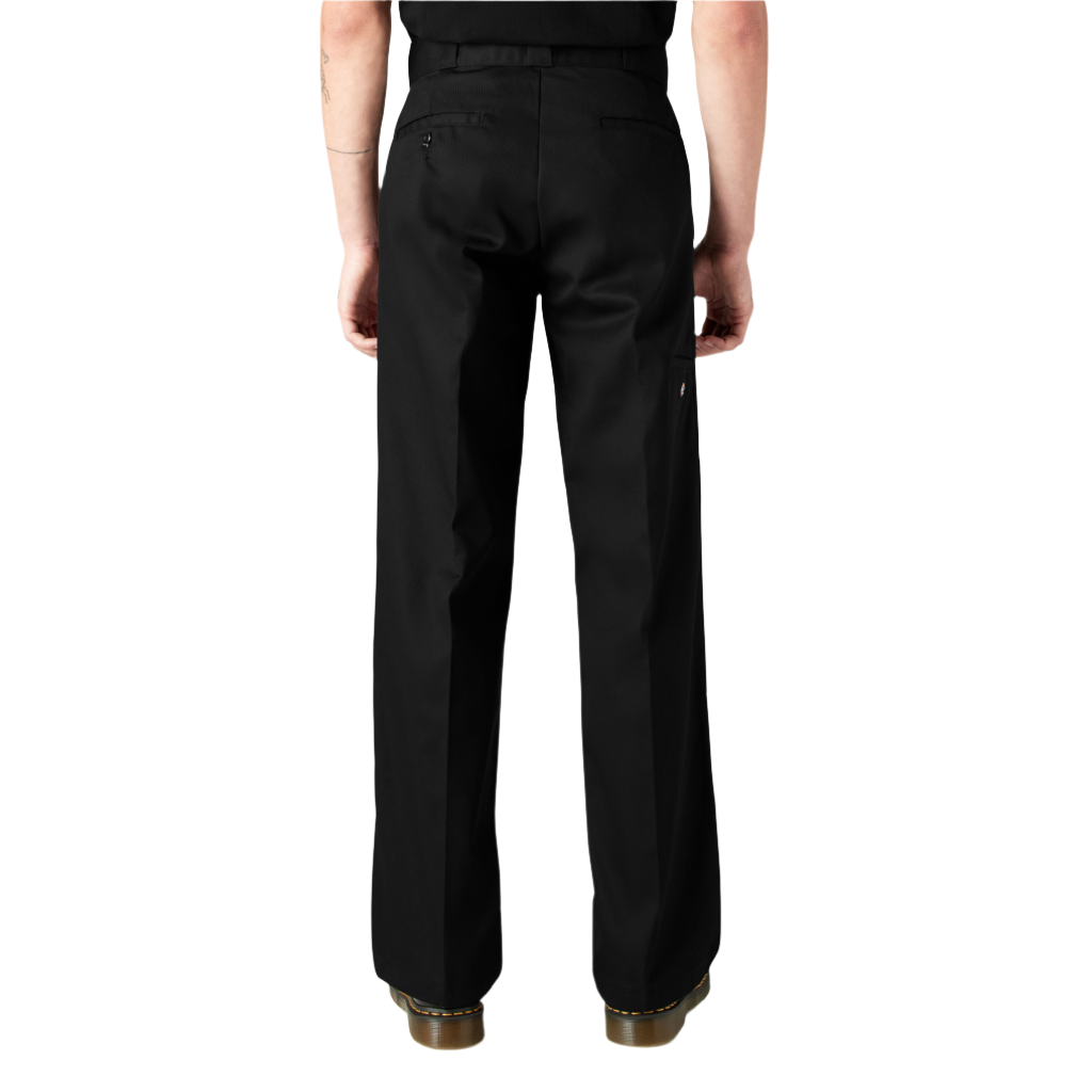 A person standing, wearing loose fit double knee work pants in black with a straight leg cut and high-rise waistband.