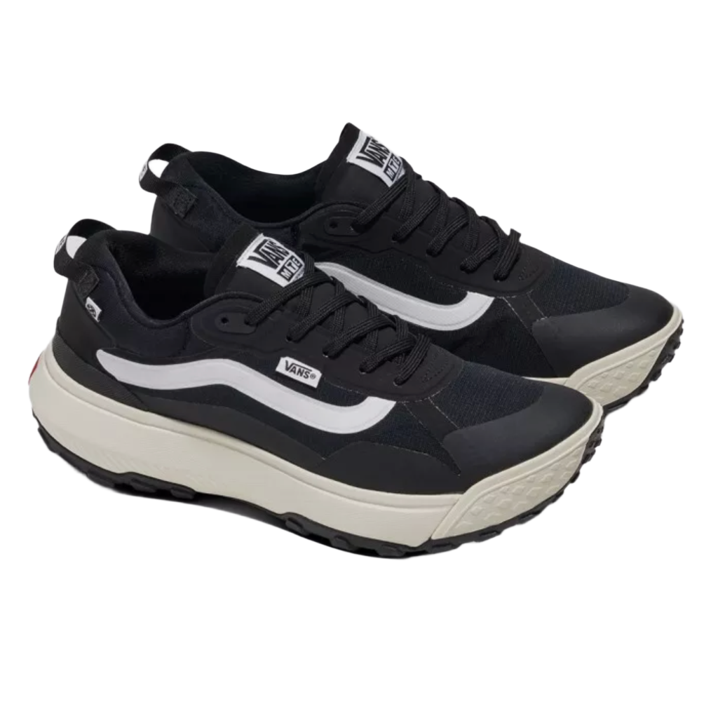 A pair of black and white panelled design sneakers with lace-up fastening and a logo patch on the tongue.