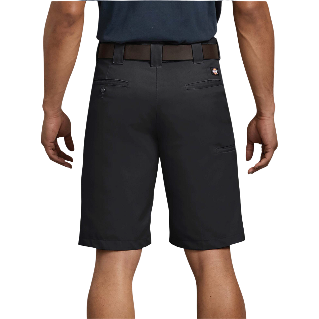 A person standing, wearing black regular fit shorts with a belt on a white background