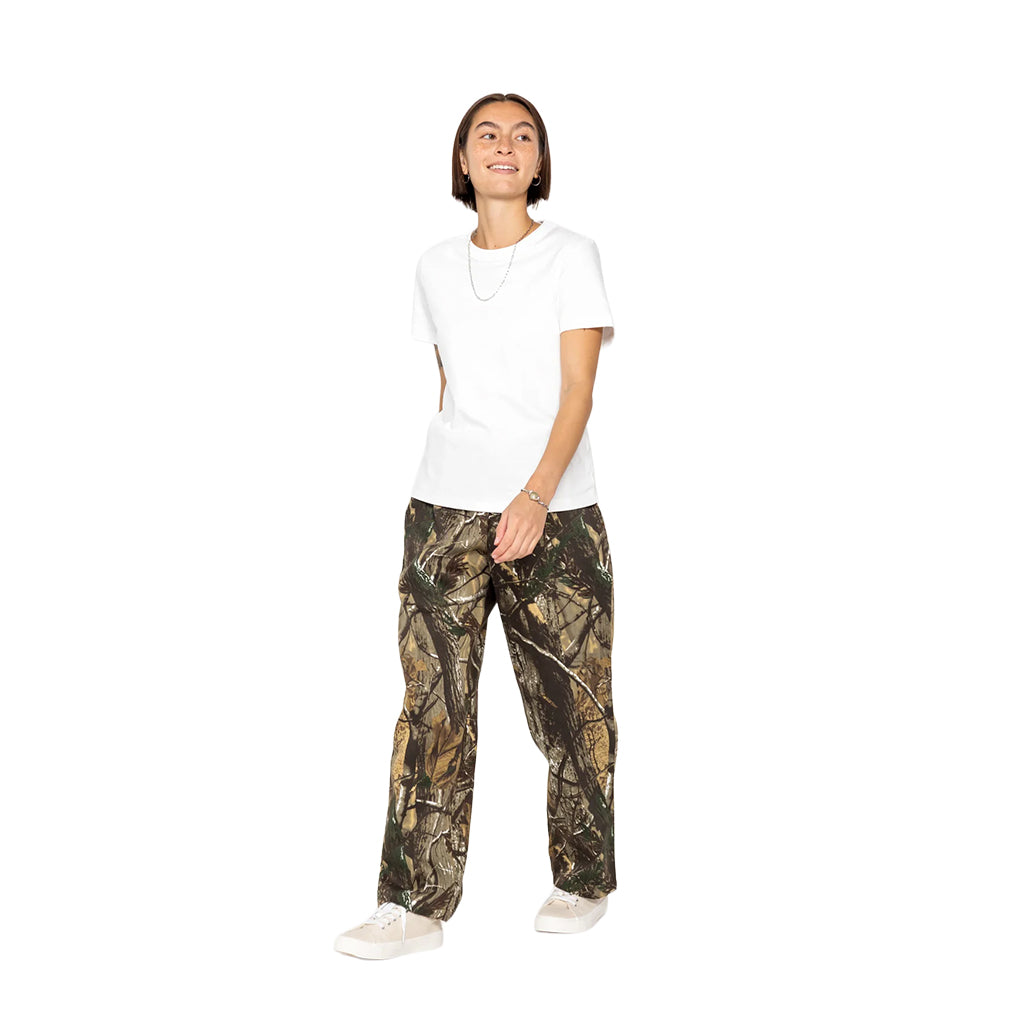 Person wearing a white shirt and camouflage pants on a white background