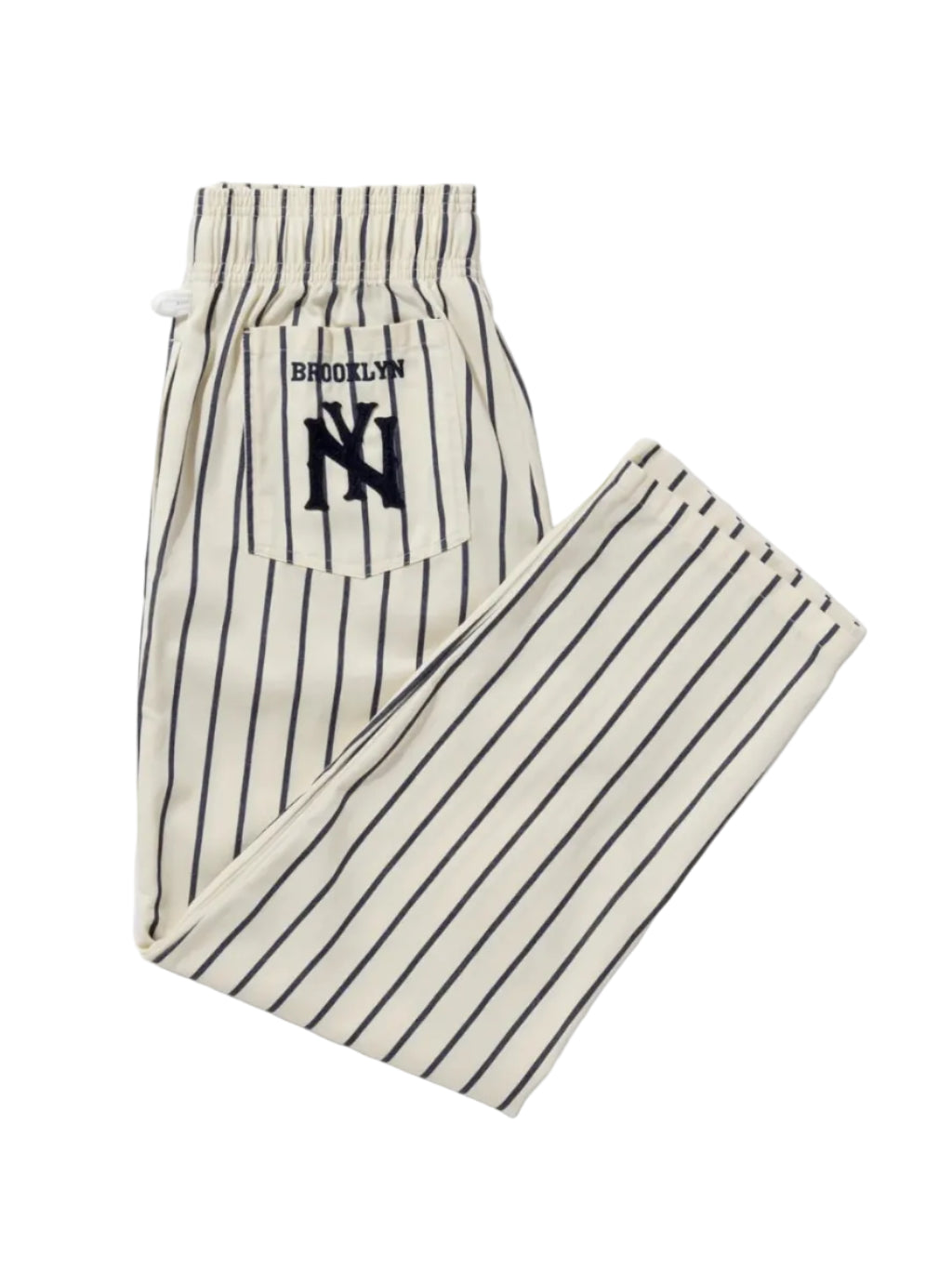 A pair of pinstriped lounge pants featuring a back pocket with a navy blue 'BROOKLYN' text and 'NY' logo patch. The pants are off-white with thin dark vertical stripes.