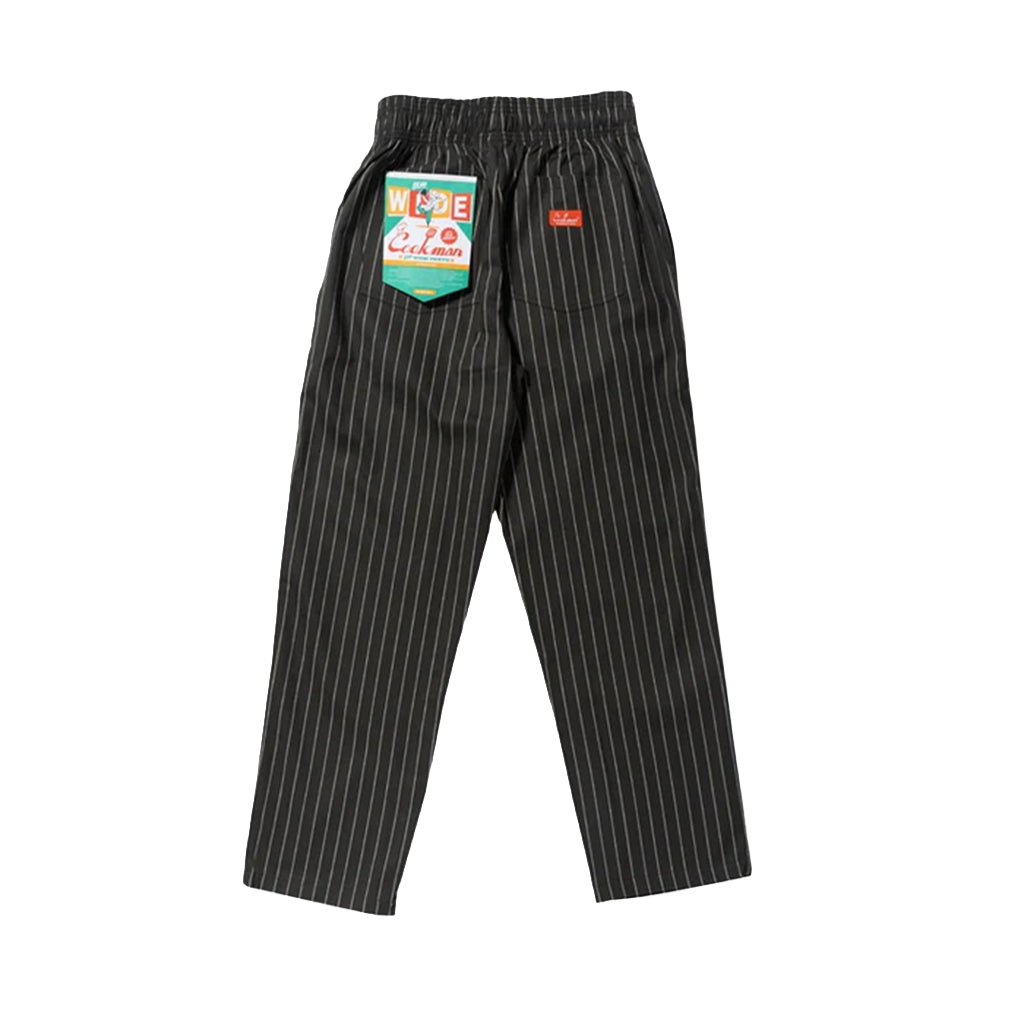 Black pinstripe pants with a label on a white background