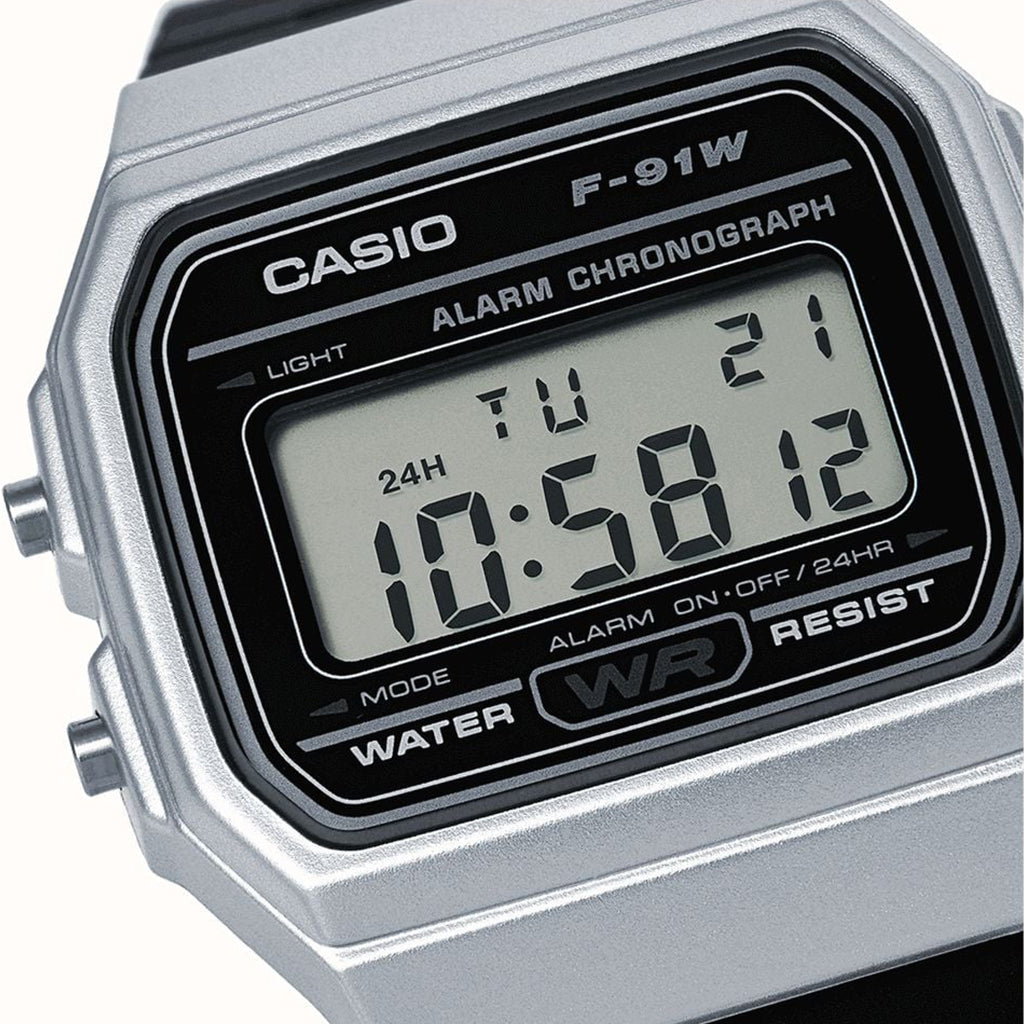 Casio digital watch with a silver case on a white background