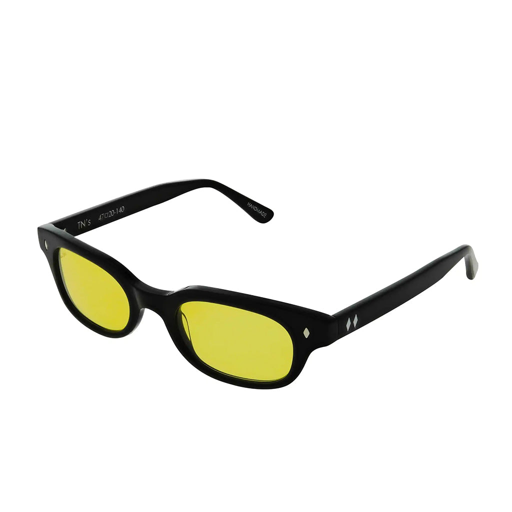 Black-framed sunglasses with yellow lenses on a white background