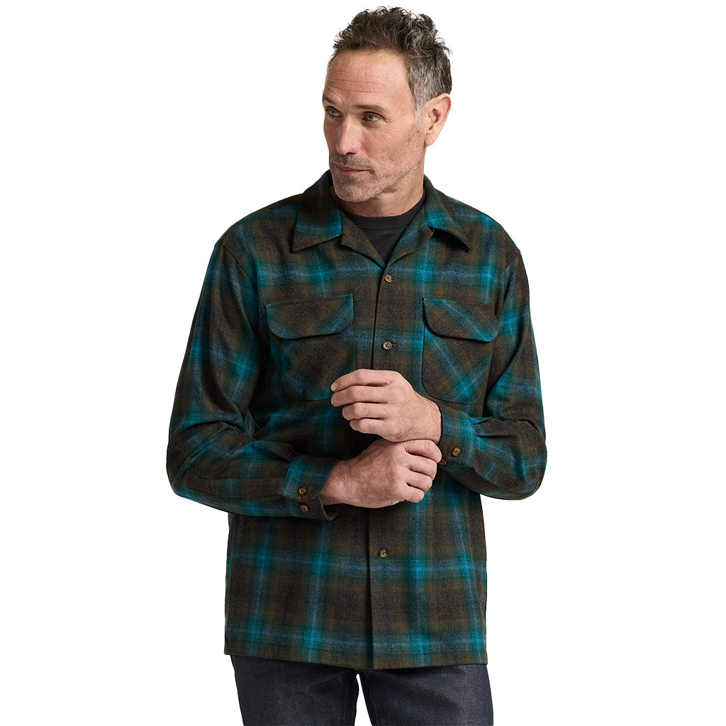Man wearing a plaid shirt on a white background
