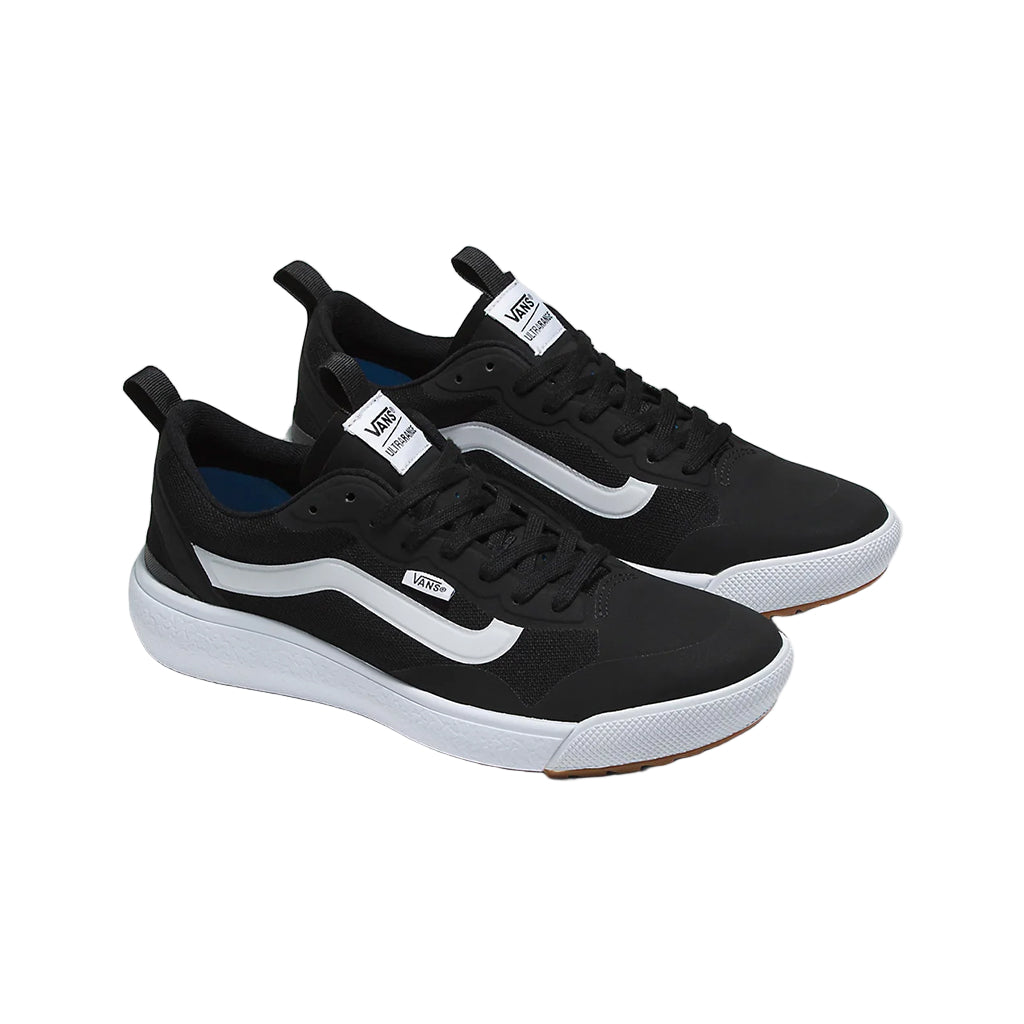 Black and white sneakers on a light gray background