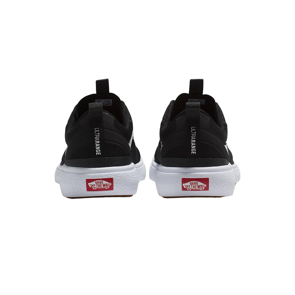 Black sneakers with red Vans logo on a white background