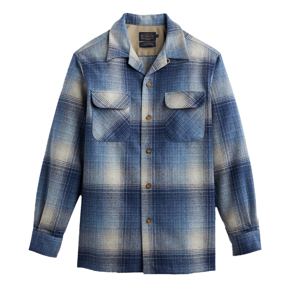 A long-sleeved, button-up shirt with a blue plaid pattern, featuring pockets on the chest.