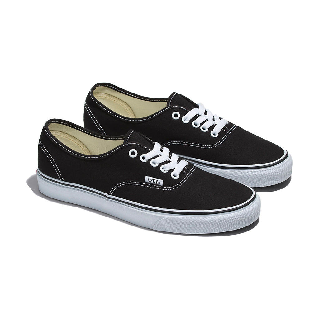 A pair of Vans Authentic black low-top sneakers with white laces and the iconic rubber waffle outsole.