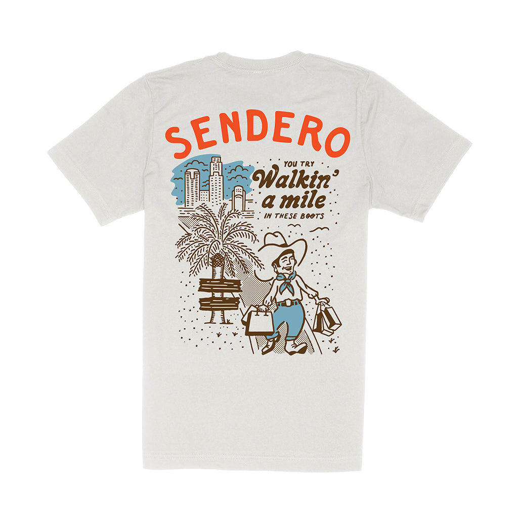 White t-shirt with Sendero graphic design on a white background