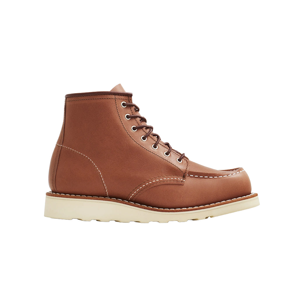 Brown leather boot with white sole on a white background