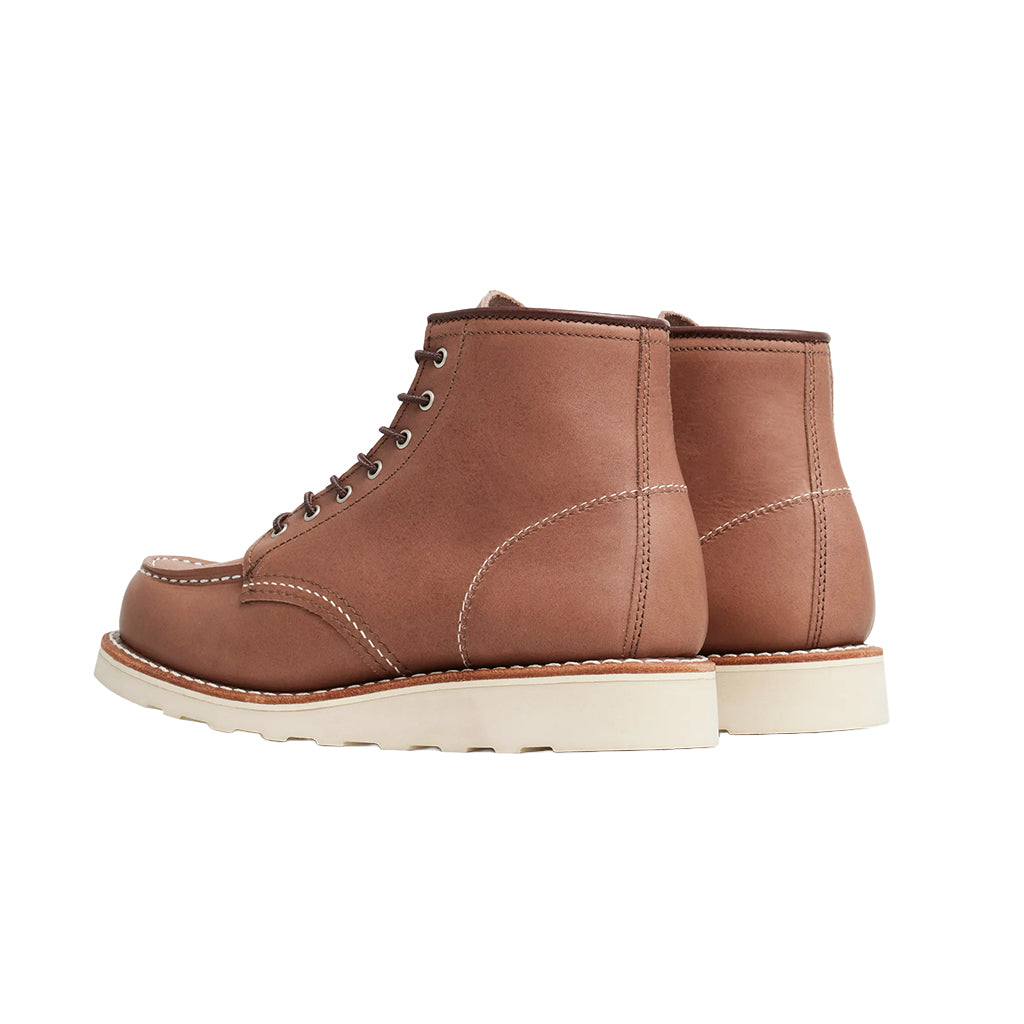 Pair of brown leather boots on a white background