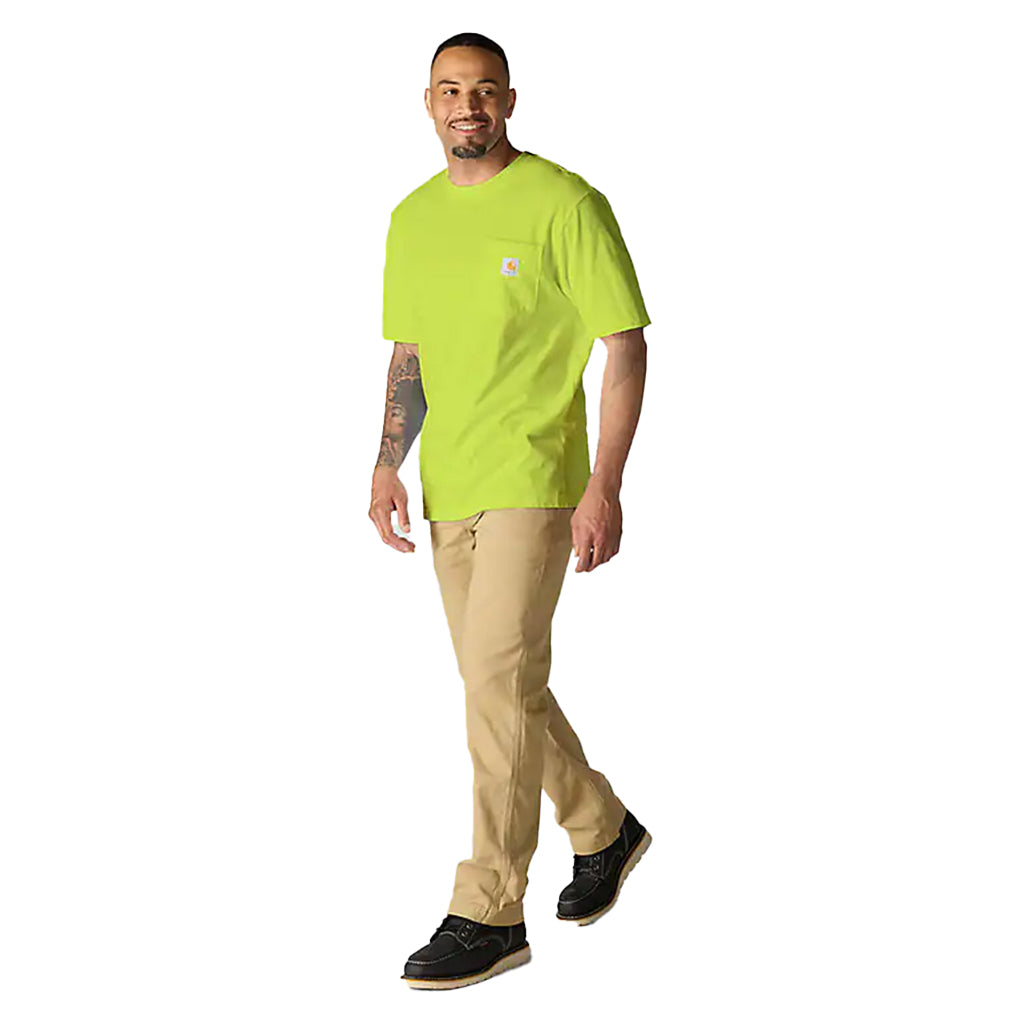 Man wearing a bright green shirt and beige pants on a white background