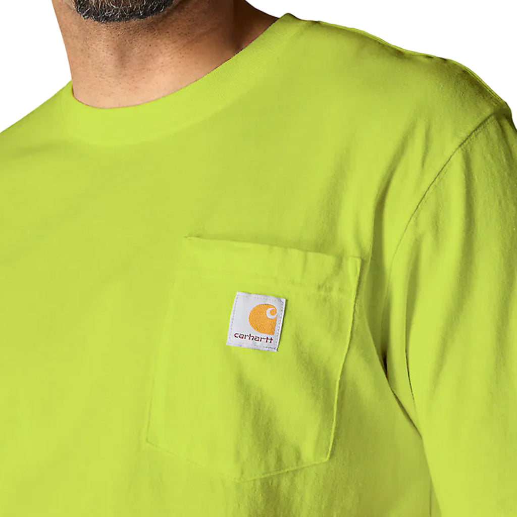 Close-up of a bright green shirt with a Carhartt logo on a plain background