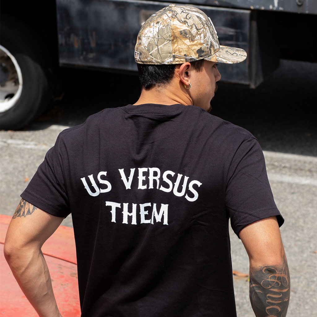 Arched Us vs. Them Tee Black