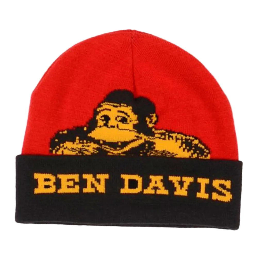A red and black knitted beanie with a cuffed design, featuring a yellow cartoon character and the text 'BEN DAVIS' on the fold.