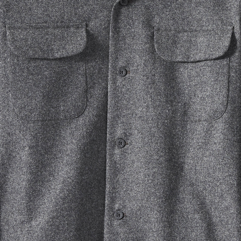 Close-up of a gray flannel shirt with button details
