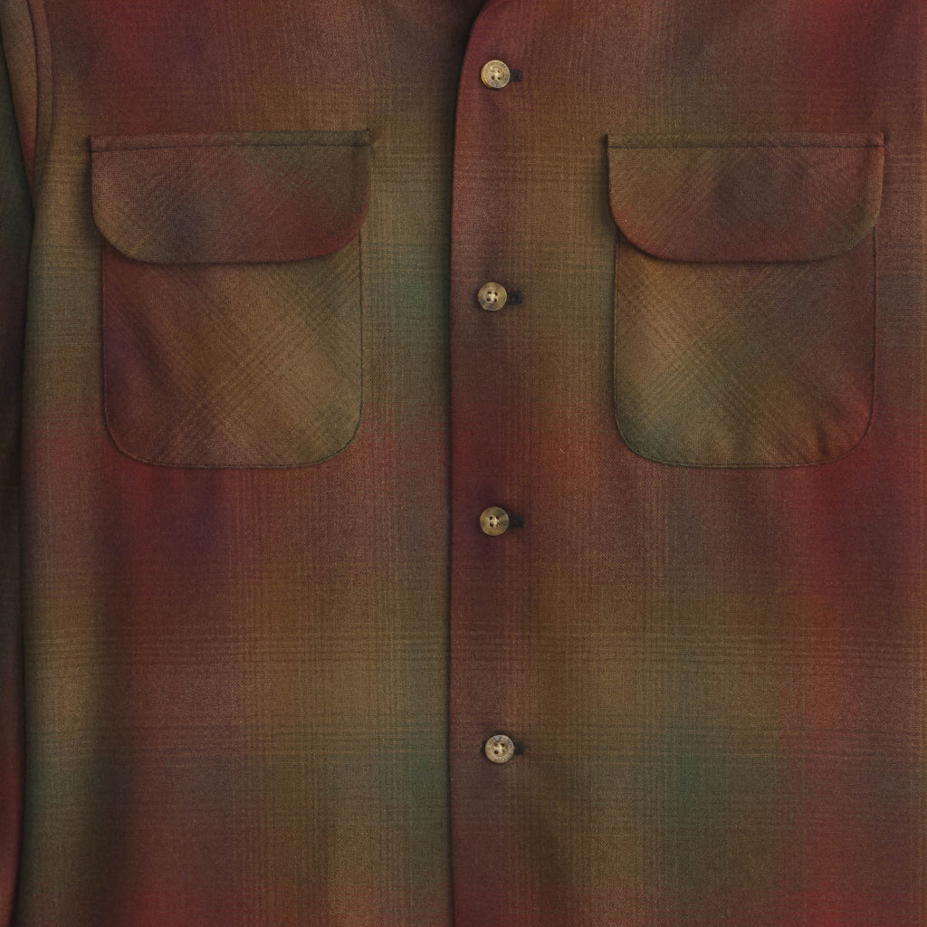 Close-up of a plaid shirt with button details