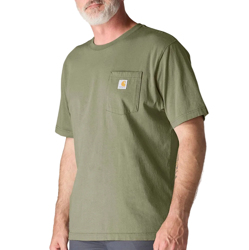 Man wearing a green t-shirt with a visible brand logo on a plain white background