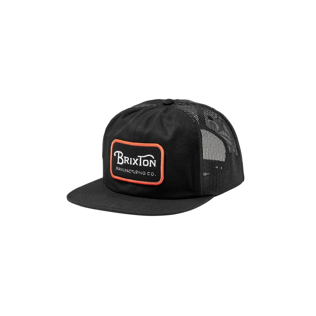 A black trucker hat with orange and white flat bill, featuring a Brixton brand patch on the front.