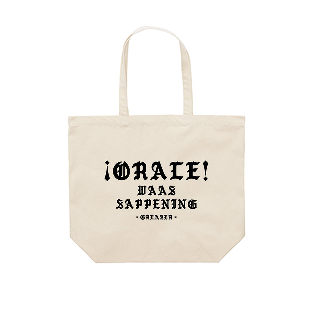 Beige tote bag with black text on a white background