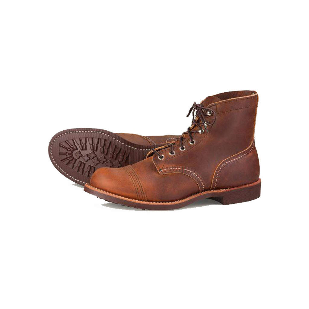 Brown leather boots on a white background