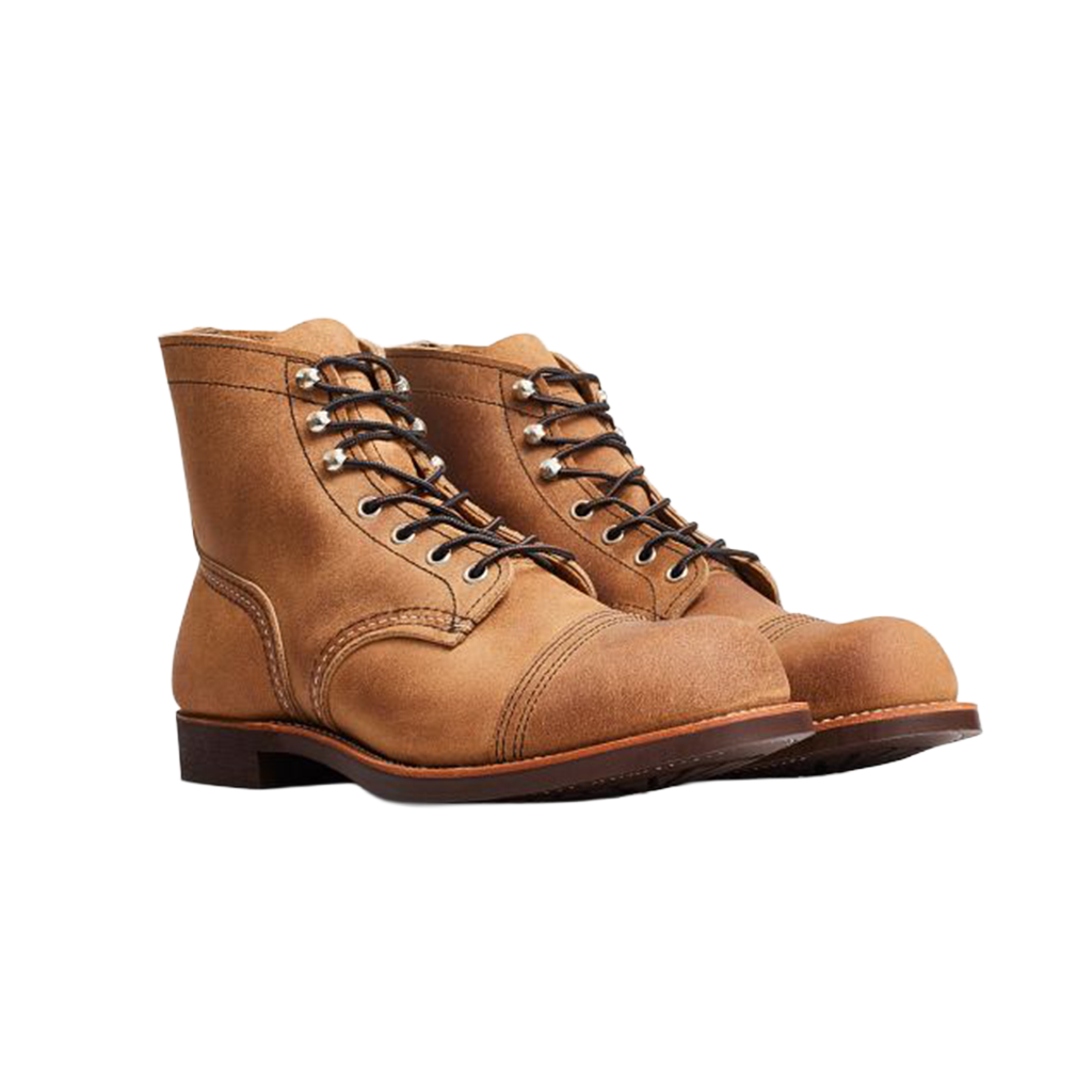 Pair of brown leather boots on a white background